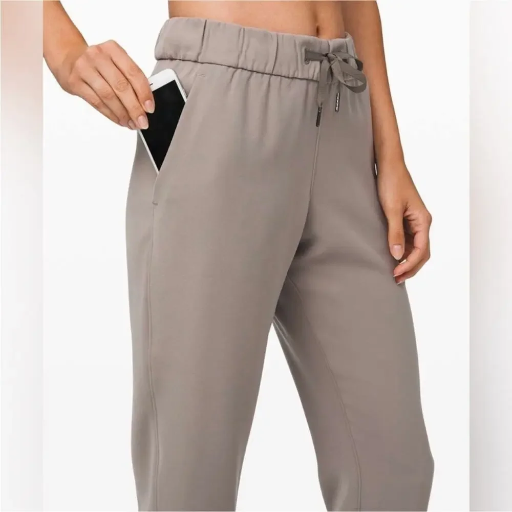 Lululemon On the Fly 7/8 Pants Woven Carbon Dust Tan Grey 8